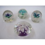 Four large flower-patterned paperweights (4)