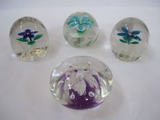 Four large flower-patterned paperweights (4)