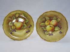 Pair of Coalport cabinet plates decorated by N Lear of apples, pears and grapes, 27cm diameter (2)