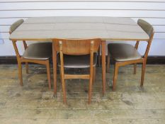 Mid 20th century melamine teak-effect drop-flap table, 78cm wide and three matching chairs with