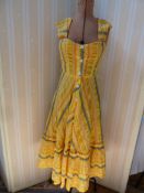 Jeff Banks yellow striped sundress, full skirt and tiered hemline, front button fastening and a