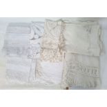 Three linen and lace tablecloths, 100cm x 120cm, an embroidered linen tablecloth, 130cm x 160cm, two