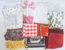 Assorted modern table linen, two aprons, a lace blouse and assorted items (1 box)