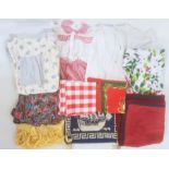 Assorted modern table linen, two aprons, a lace blouse and assorted items (1 box)