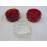 Two Whitefriars bark-effect red ashtrays and another clear glass bark-effect ashtray, 12cm