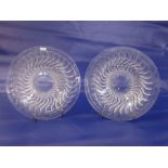 Pair of Rene Lalique Actina pattern clear glass dishes with underside relief decoration, marked to