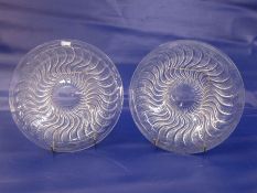 Pair of Rene Lalique Actina pattern clear glass dishes with underside relief decoration, marked to