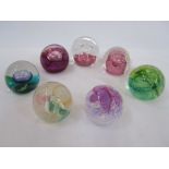 Seven assorted Caithness paperweights to include 'Ruby Celebration', 'Cauldron' and 'Daydreams' (7)