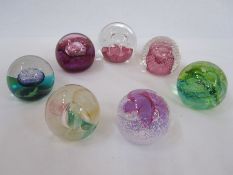 Seven assorted Caithness paperweights to include 'Ruby Celebration', 'Cauldron' and 'Daydreams' (7)