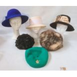 Assorted hats to include a knitted 1960/70's hat with plastic discs and a black net and velvet hat