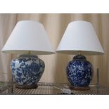 Chinese-style blue and white vase table lamp, on circular wooden base with cream shade and another