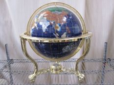 20th century globe in brass-coloured stand, with countries made from various hardstones, compass