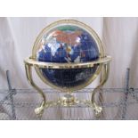 20th century globe in brass-coloured stand, with countries made from various hardstones, compass