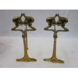 Pair of Art Nouveau brass firedogs with silver-coloured screws, 23.5cm high (2)