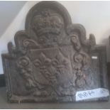 Cast iron fireback with shield decoration surmounted by a crown, the shield three fleur-de-lys