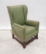 Early 20th century wing-back chair in green upholstery