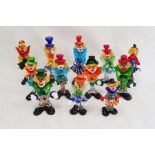 12 assorted Murano glass clowns including musicians, the tallest 26cm high (12)