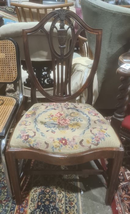 Mahogany framed Hepplewhite style chair, the shield shaped back above serpentine fronted