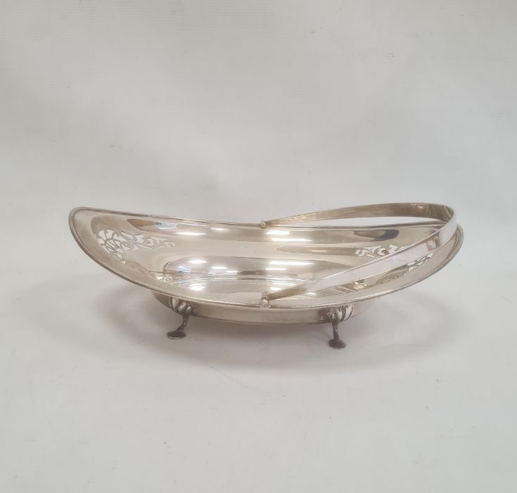 1920s silver oval cake basket, pierced decoration on splayed feet, swing handle, Birmingham 1922,