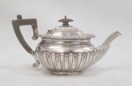 A Victorian silver teapot, ebony handle and finial, semi gadrooned, initialled 'R' , Edinburgh 1883,