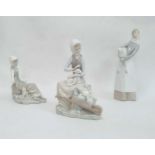 Lladro figure of a girl holding a lamb, 27cm high, a Lladro model of a seated girl with lamb and a