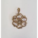 Gold brooch pendant set with seedpearls, with a central flowerhead within scrolling border, marked