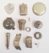 A silver medallion, Birmingham 1914, a silver vesta, a 9ct gold mounted cheroot holder in a silver