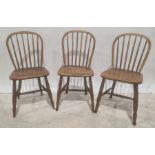 Three elm seated stick-back chairs and one further armchair (4)