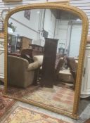 C Nosotti, late Victorian large arch-topped overmantel mirror in moulded frame, with plaque to