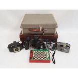 Pair of Dunhill Eagle 12x30 binoculars in leather case, a travelling chess set, a small vintage