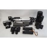 Pair of Zeiss 10x40 binoculars, a Praktica B200 camera, a pair of Regent 8x30 binoculars in