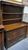 20th century oak dresser, shelves above two drawers, two cupboard doors, 122cm x 176cm