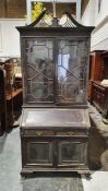 Circa 1920's Georgian style bureau bookcase, swan neck pediment above the astragal glazed doors