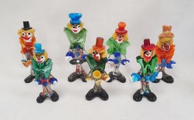 Murano glass clown playing an instrument, with blue hat, 29cm high and six others (7)