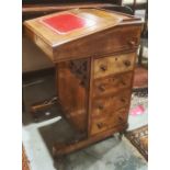 19th century davenport desk with three-quarter gallery top, the fall with red leather inset and
