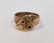 Gold-coloured band ring surmounted by an applied leaf set with two stones in rubover setting (