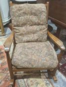 A teak Scandinavian style rocking chair labelled 'Scandart Ltd High-Wycombe'