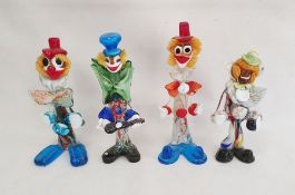 Murano glass clown playing an instrument, with blue top hat, 31cm high, another holding a ball, with