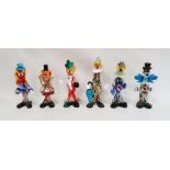 Murano glass clown holding a blue umbrella, 29cm high, another holding a marbled ball and four other