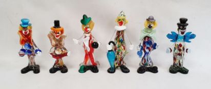 Murano glass clown holding a blue umbrella, 29cm high, another holding a marbled ball and four other