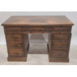 Late 19th/early 20th century oak nine drawer pedestal desk on plinth base Condition Report