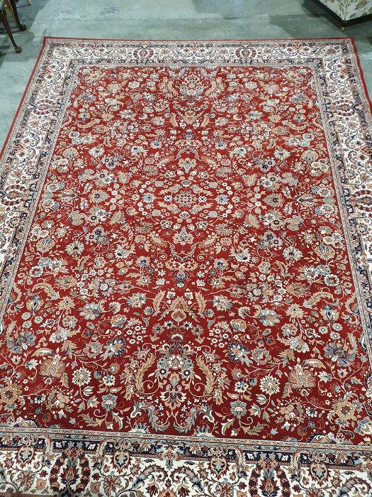 Modern red ground rug with allover foliate decoration, cream ground foliate decorated border, - Image 2 of 4