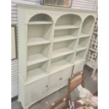 Painted dresser, the moulded cornice above three arches enclosing shelves, four cupboard doors