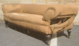 In the manner of Howard & Sons of London three-seat Chesterfield sofa on turned legs, brass Howard-