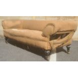 In the manner of Howard & Sons of London three-seat Chesterfield sofa on turned legs, brass Howard-