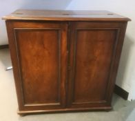 Late 19th/early 20th century two door cupboard, the rectangular top with moulded edge, the front