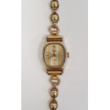 Lady's RG Pulsar wristwatch with striped rounded oblong dial and the 9ct gold ball and oval link