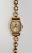 Lady's RG Pulsar wristwatch with striped rounded oblong dial and the 9ct gold ball and oval link