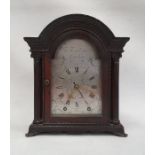 Mantel alarm clock the moulded arch top above single glazed door enclosing steel face marked 'JN