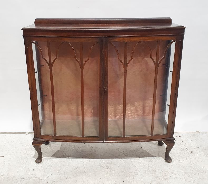 20th century bow-front display cabinet, astragal glazed doors enclosing shelves, cabriole